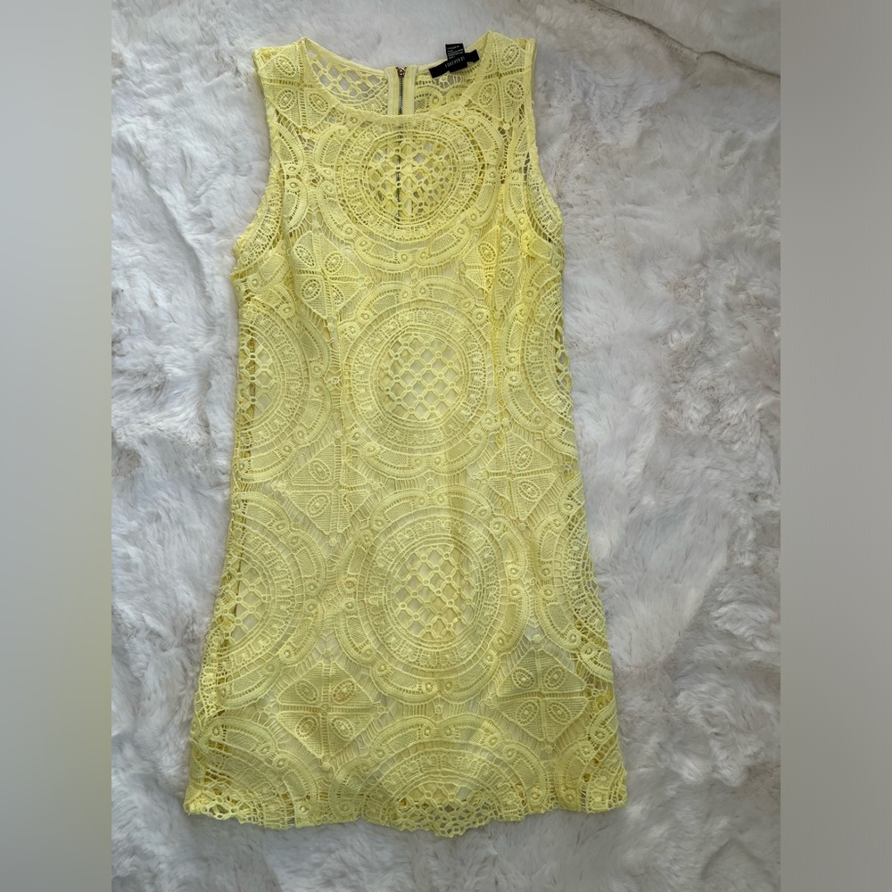 Yellow sleeveless summer dress.